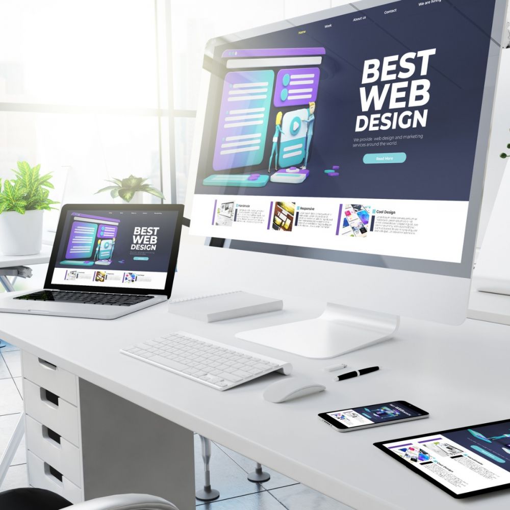 computers with website design on screen