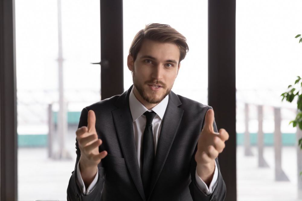 male executive speaking intensely into camera