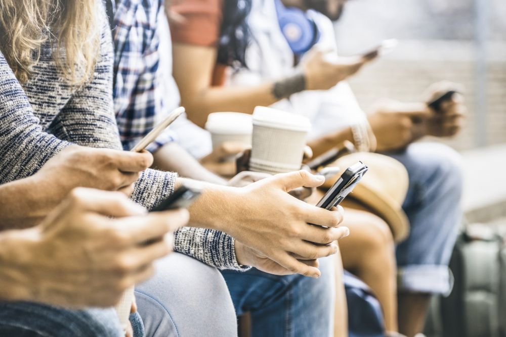 young people obsessed with smartphones and coffed